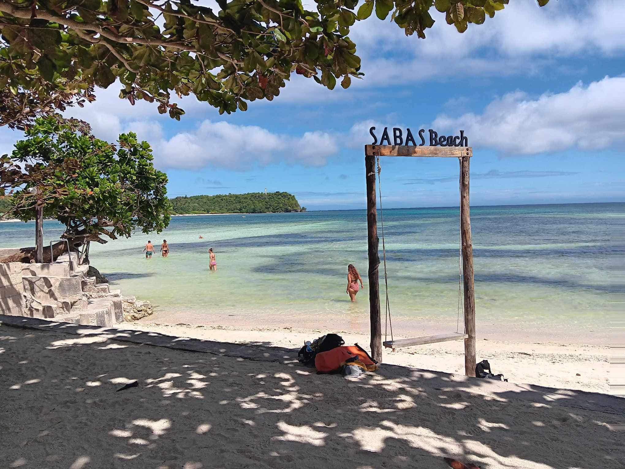 Guests relaxing on beautiful Sabas Beach shoreline